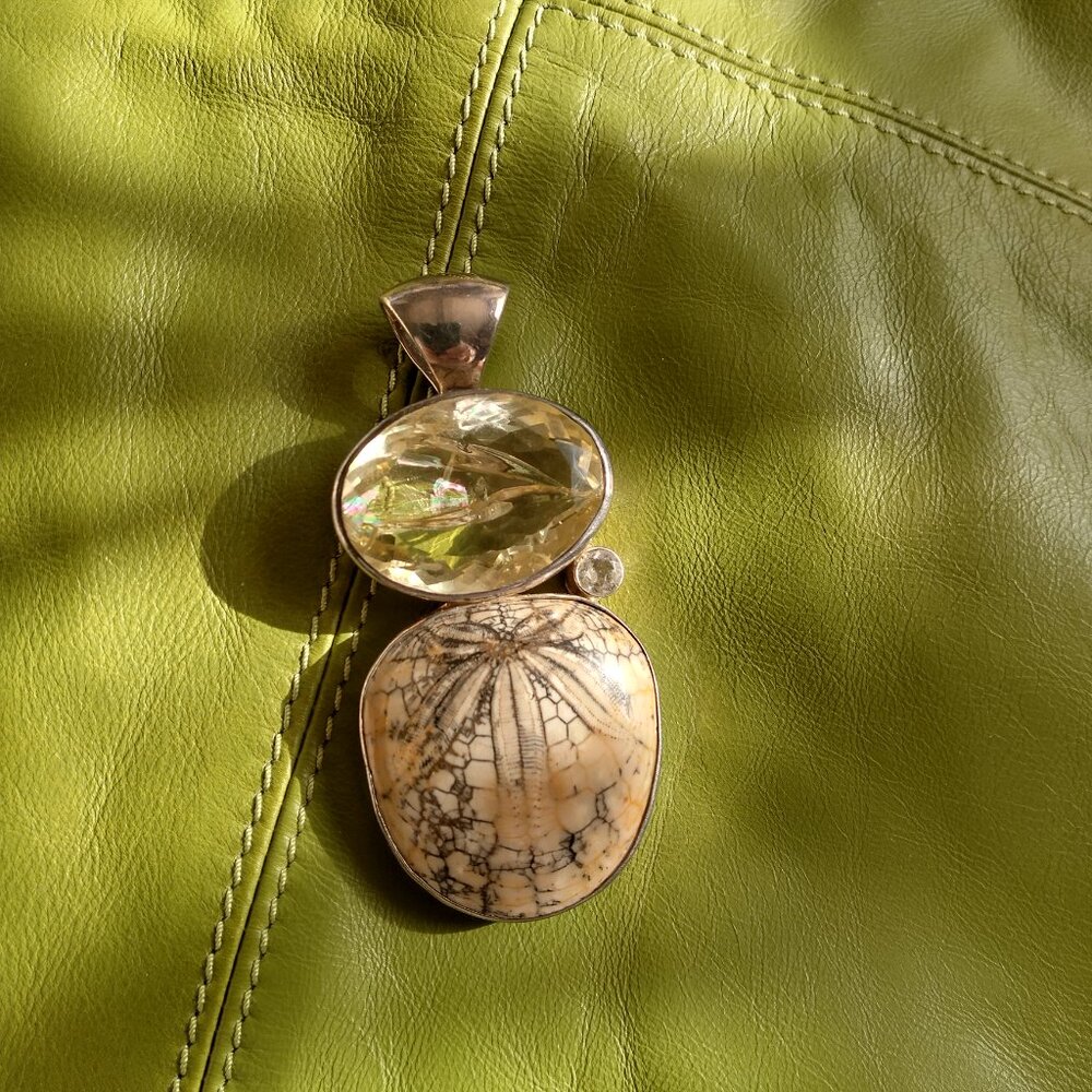 Pendant; fossilized sand dollar, citrine & natural crystal, sterling silver.